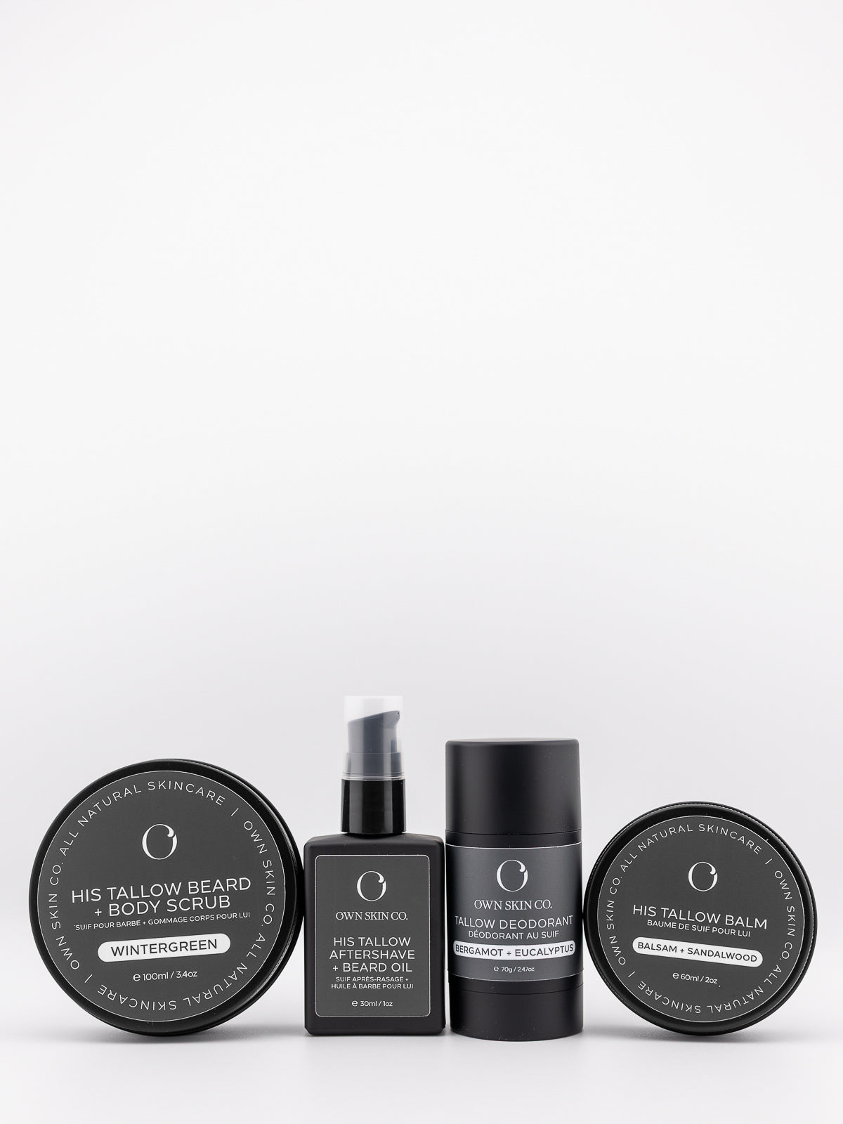 Men's Beef Tallow Skincare including balm, deodorant, beard scrub and beard oil in a line with white background