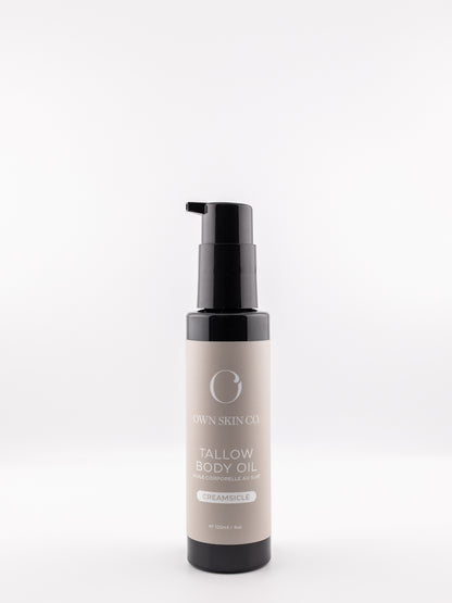 Tallow body oil citrus vanilla creamsicle bottle with pump on a white background. Made in Canada body serum with beeswax