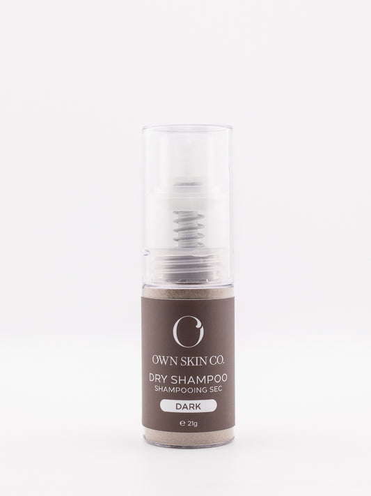 A Natural spray Dry shampoo bottle with brown label on a white background with clean ingredients and no butane