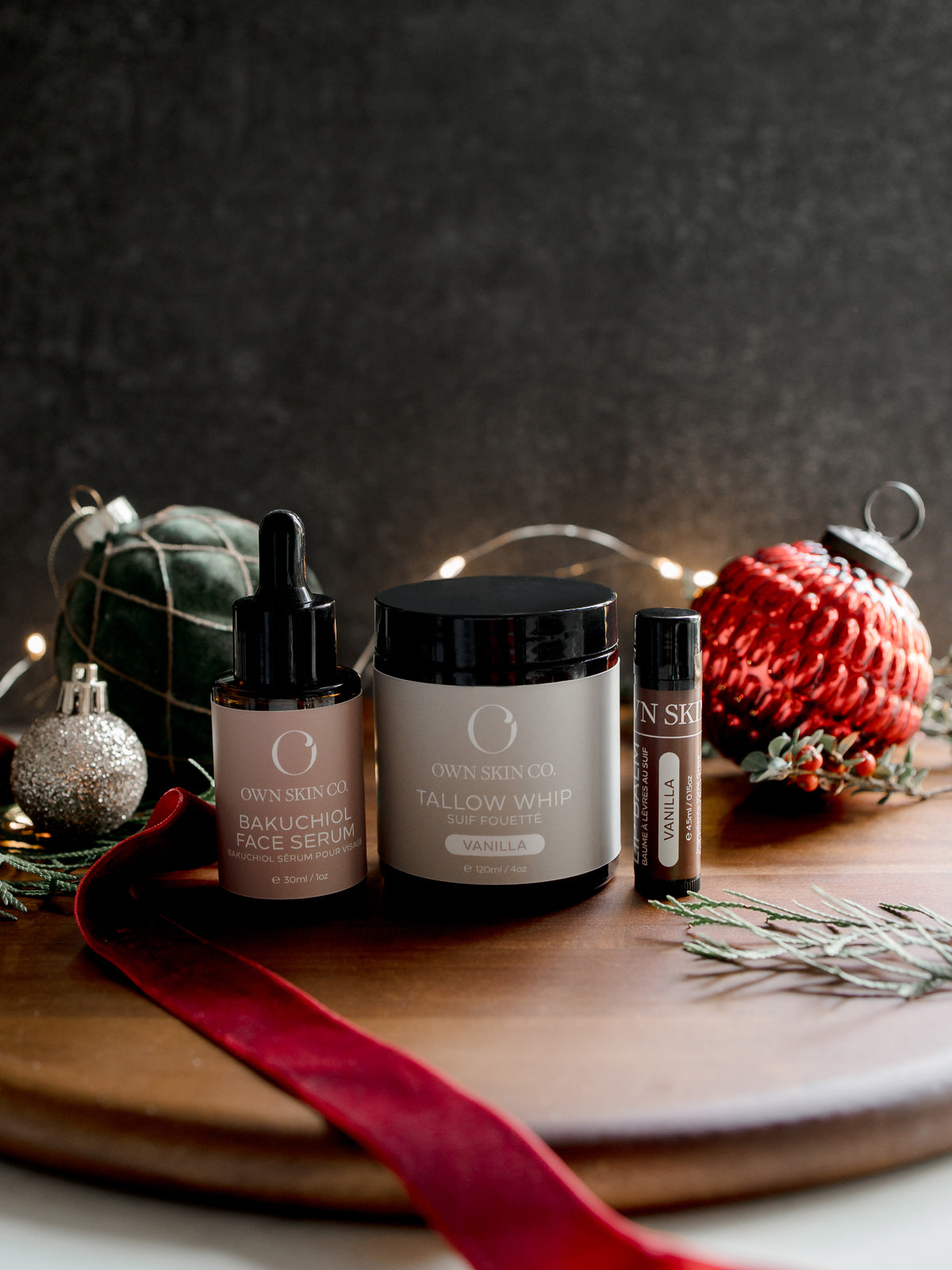 Beef Tallow Skincare products on a wooden tray with festive decorations