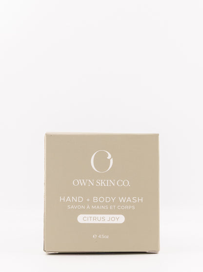 Own Skin Co. Hand & Body Wash box in Citrus Joy scent, featuring a minimalist beige packaging design with white text and logo on a clean white background.