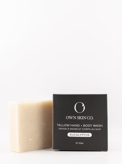 A bar of Own Skin Co. Tallow Hand & Body Wash in Eucalyptus scent, shown next to its black packaging box on a clean white background.