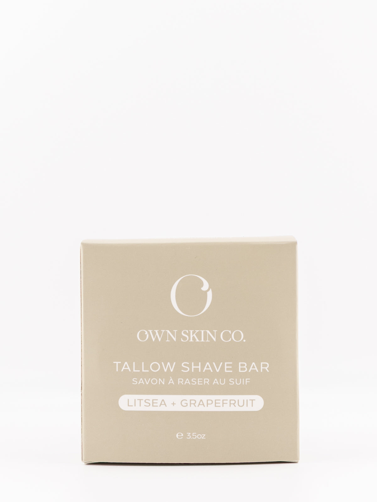 Own Skin Co. Tallow Shave Bar packaging box in a light beige color, featuring white text and logo, on a seamless white background.