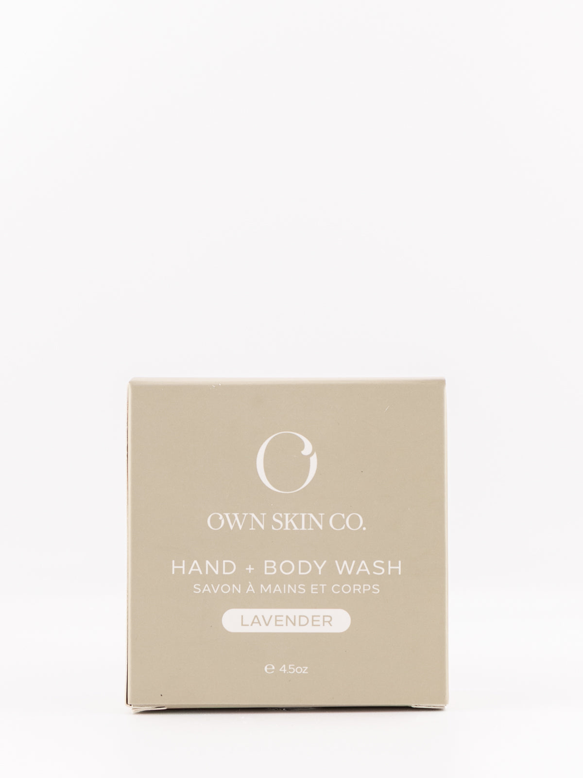 OWN SKIN CO. Hand & Body Wash lavender scent in a square beige box, photographed against a seamless white background.