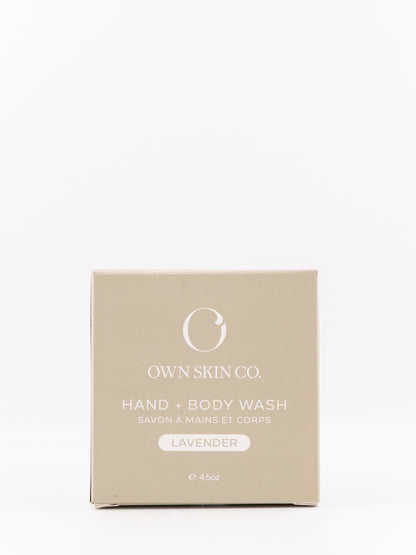 OWN SKIN CO. Hand & Body Wash lavender scent in a square beige box, photographed against a seamless white background.