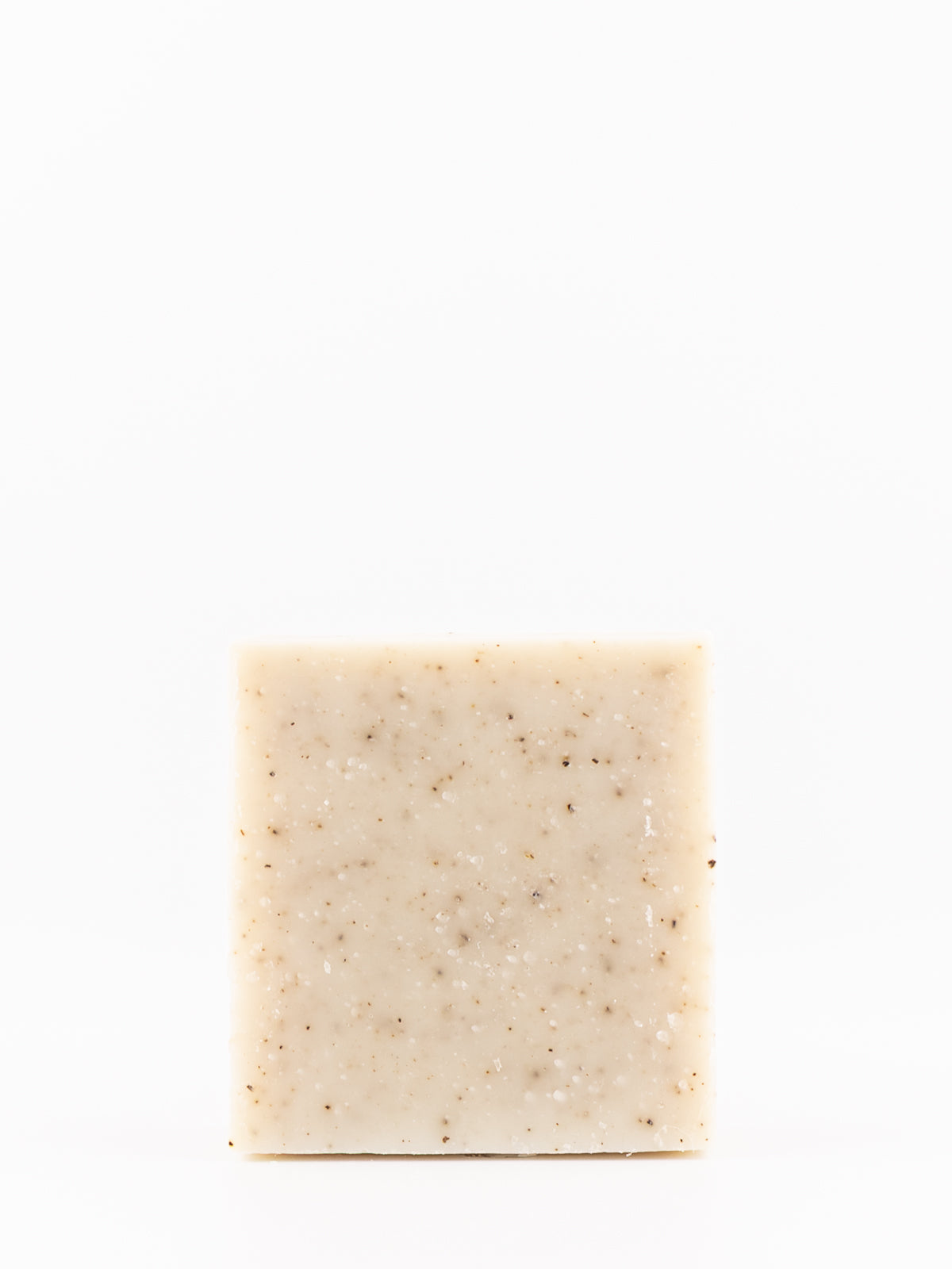 A rectangular bar of own skin's men's rosemary mint body wash. A light beige soap with small brown and white specks, centered against a solid white background.
