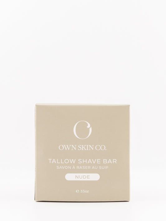 Own Skin Co. Tallow Shave Bar in a square beige box with white text, labeled 'NUDE' on a clean white background.
